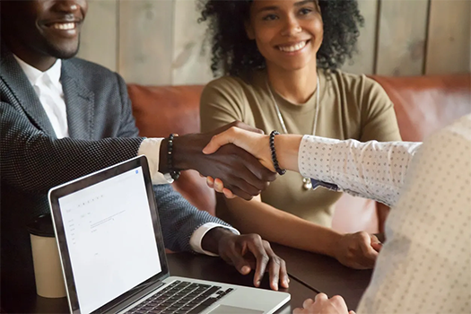Home buyers meeting with a renovation-loan professional