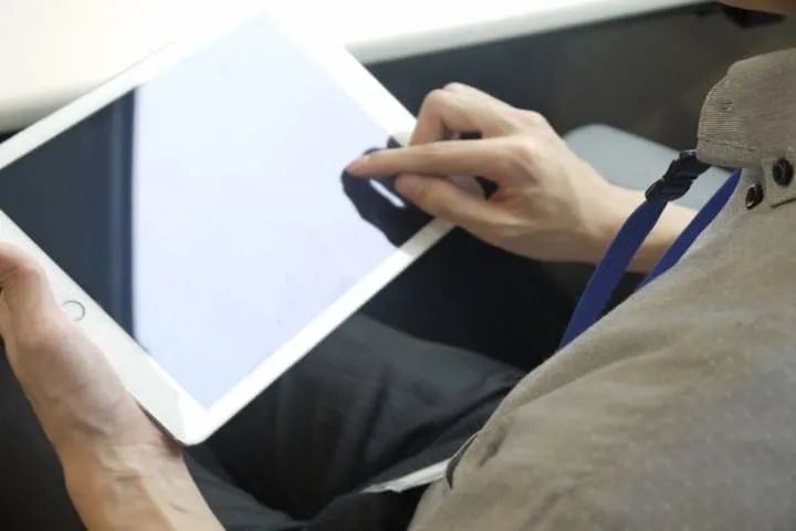 Home professional documenting a property with a tablet
